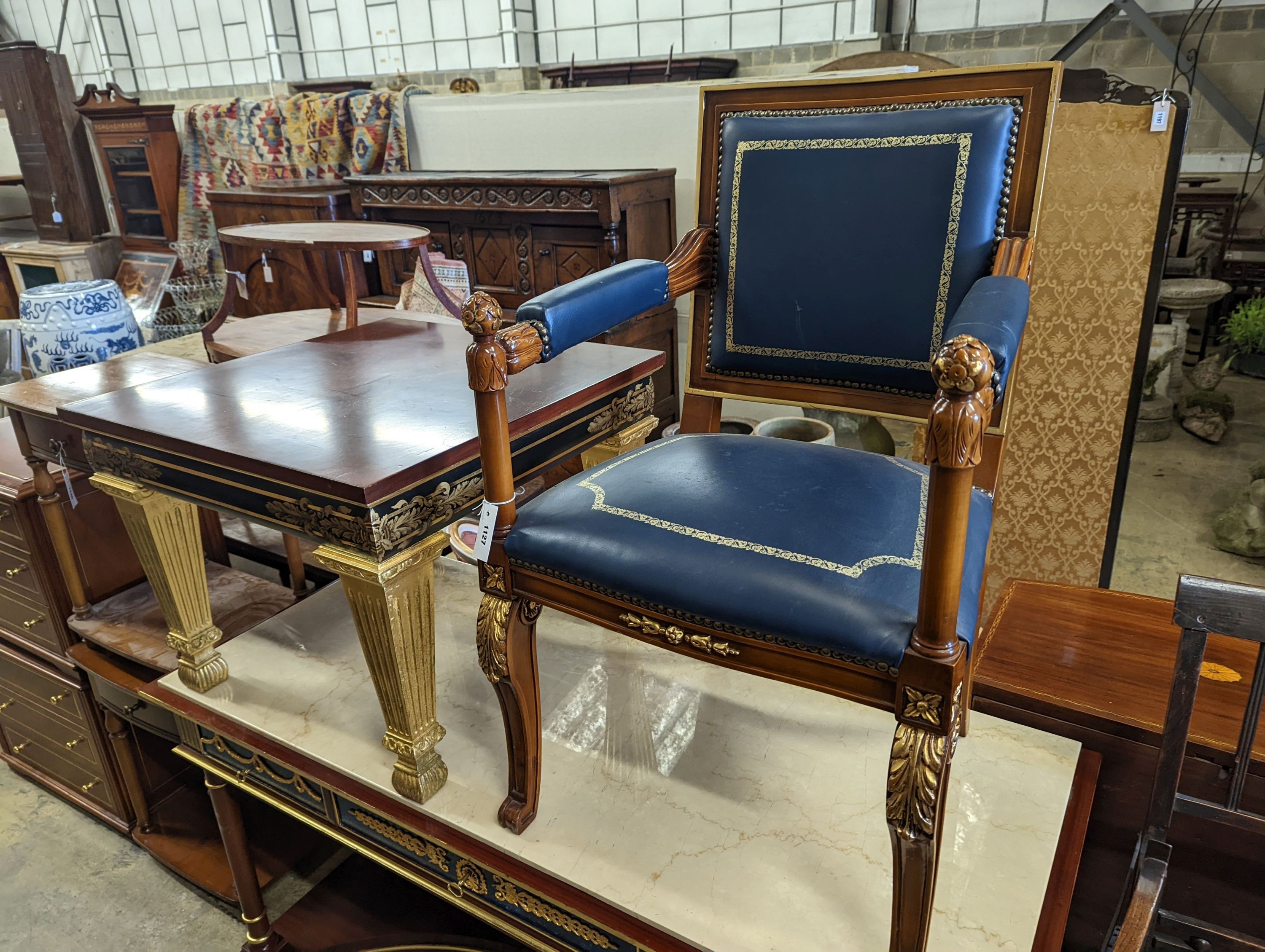 An Empire style parcel gilt mahogany elbow chair together with a similar square low occasional table, width 70cm, height 55cm